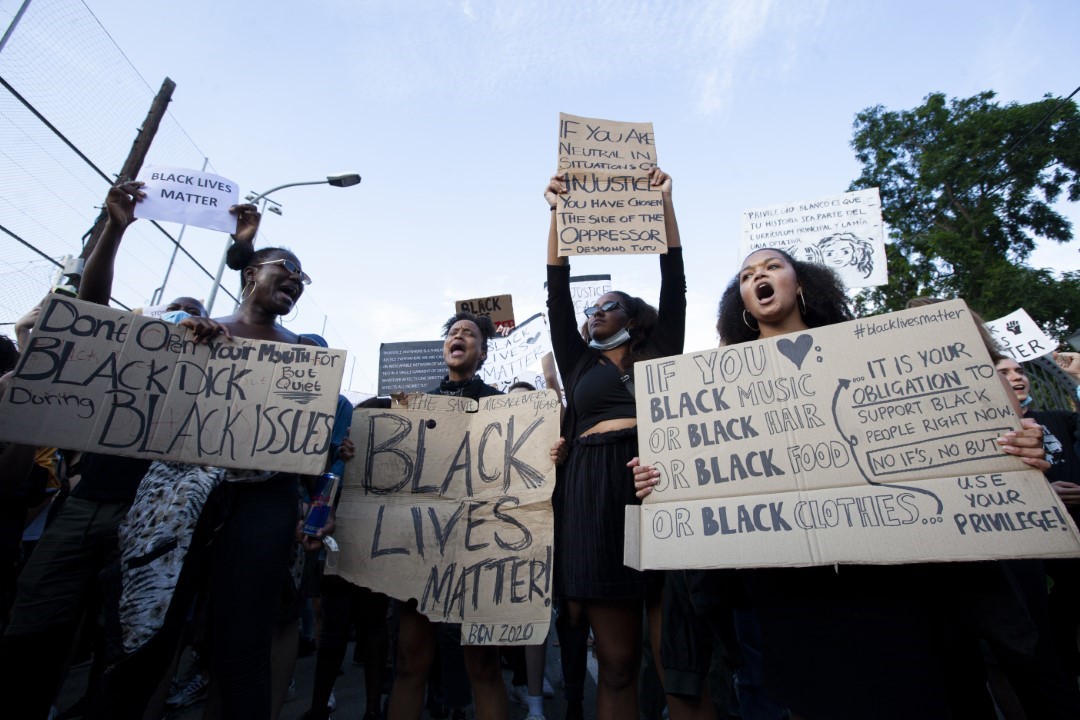 Protesters at the US consulate in Barcelona denouncing the murder of George Floyd, against racism and police brutality. June 1, 2020; Barcelona.